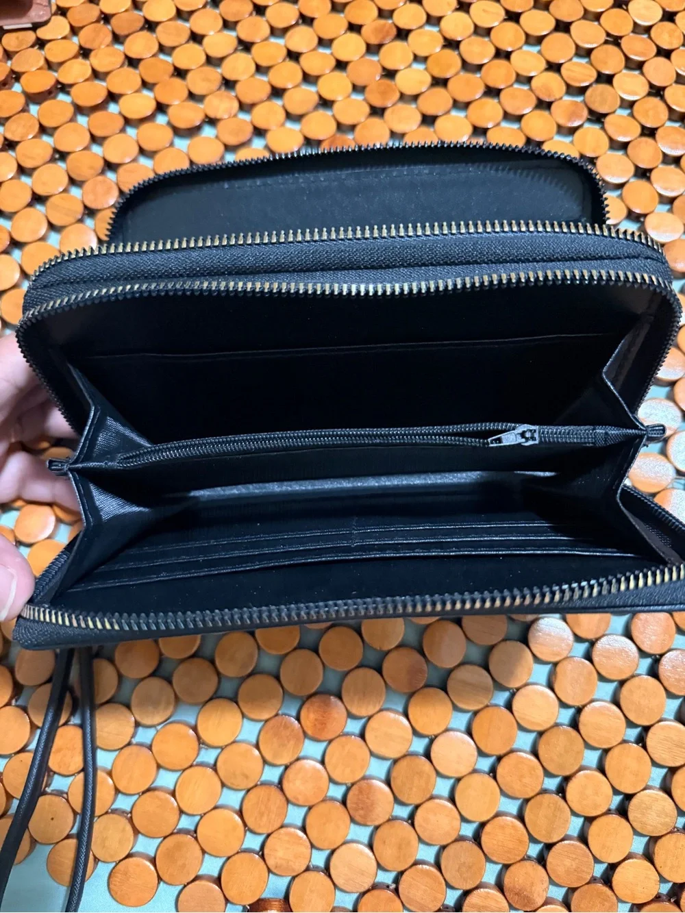 Classic Black Wristlet Clutch with Decorative Gold Emblem